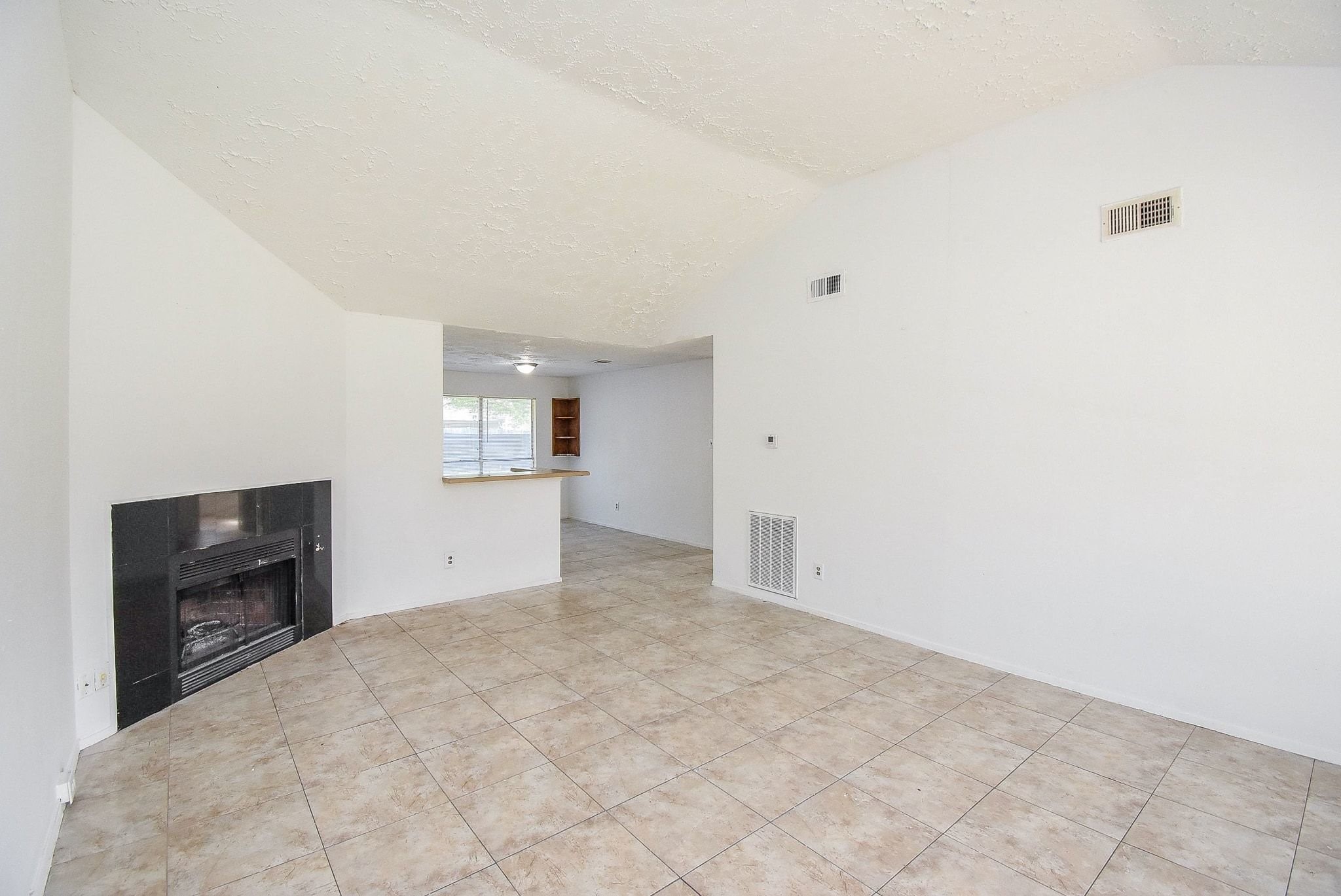 16330 Meadowbrook Farm Road Houston, TX 77082 - Photo 5 of 20 a view of a kitchen with refrigerator and cabinets