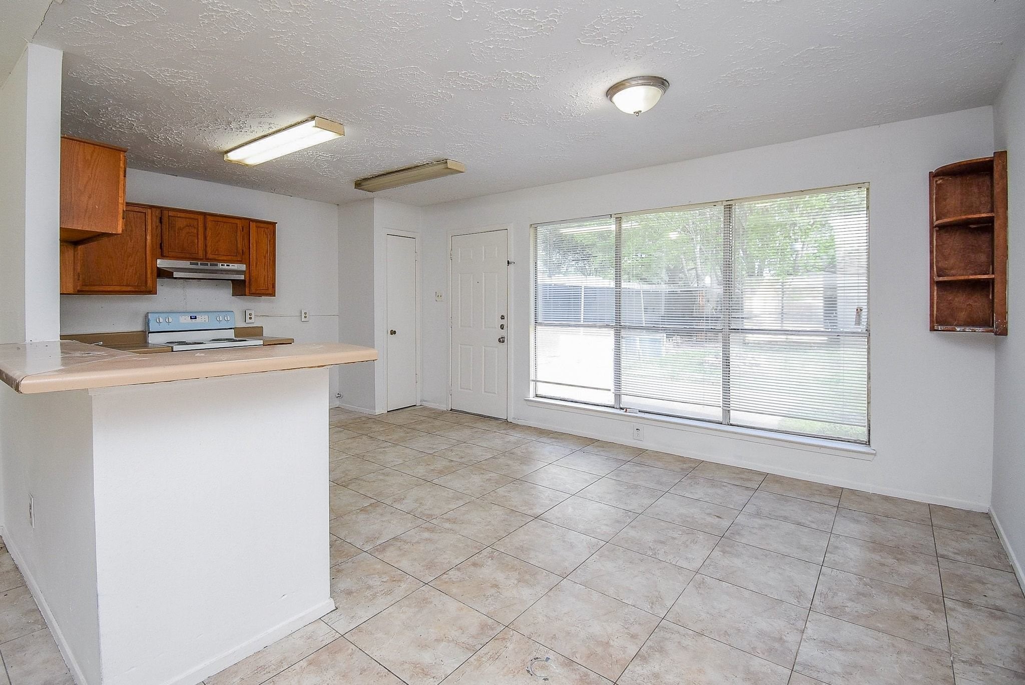 16330 Meadowbrook Farm Road Houston, TX 77082 - Photo 7 of 20 a view of a kitchen with a sink and a window