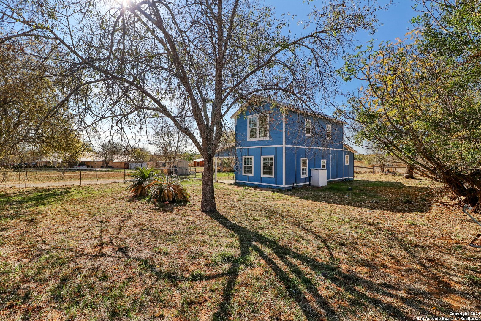 132 Renfro Drive Devine, TX 78016 - Photo 26 of 36 a view of a house with a yard covered in snow