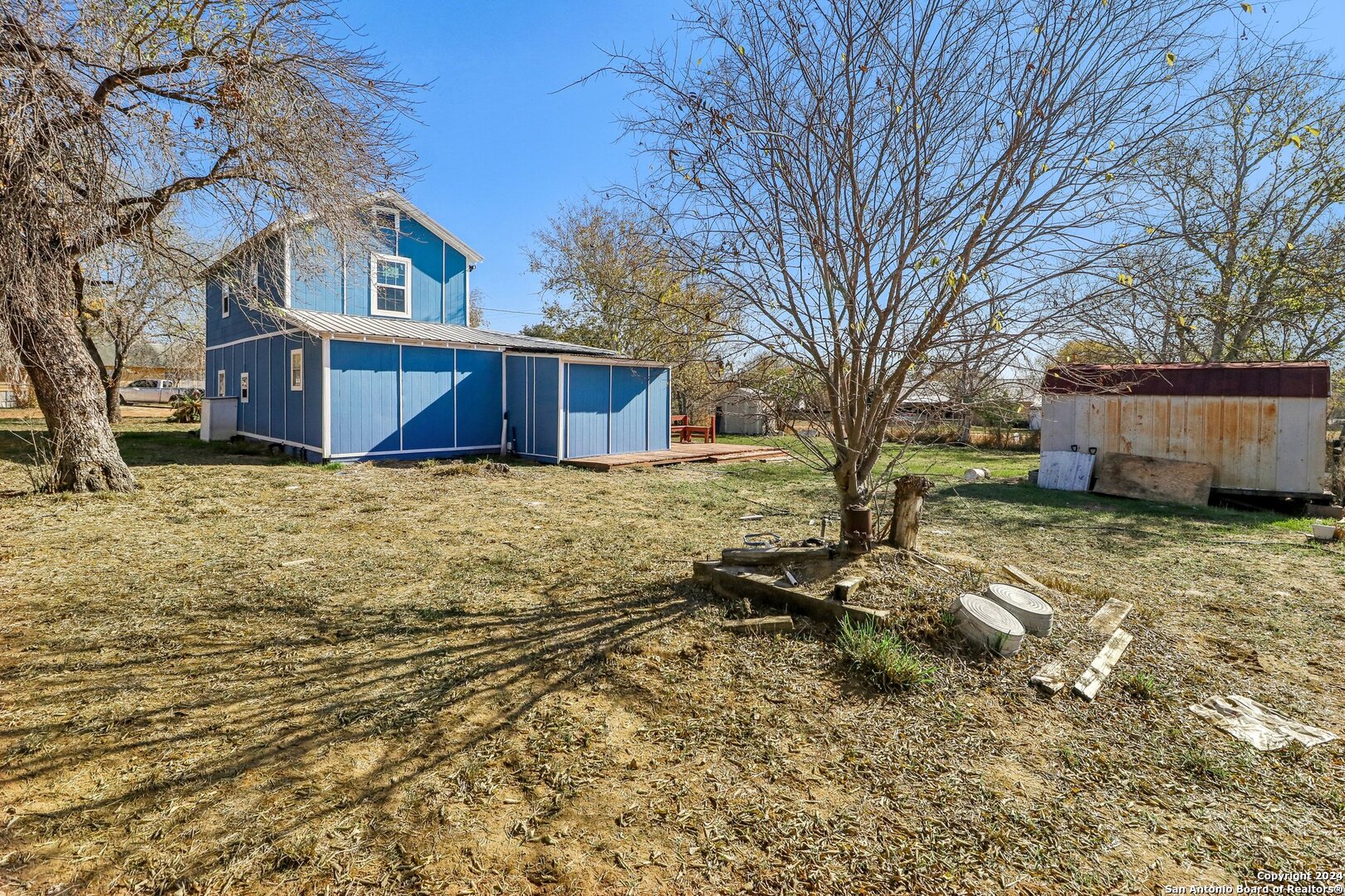 132 Renfro Drive Devine, TX 78016 - Photo 28 of 36 a view of a house with a yard