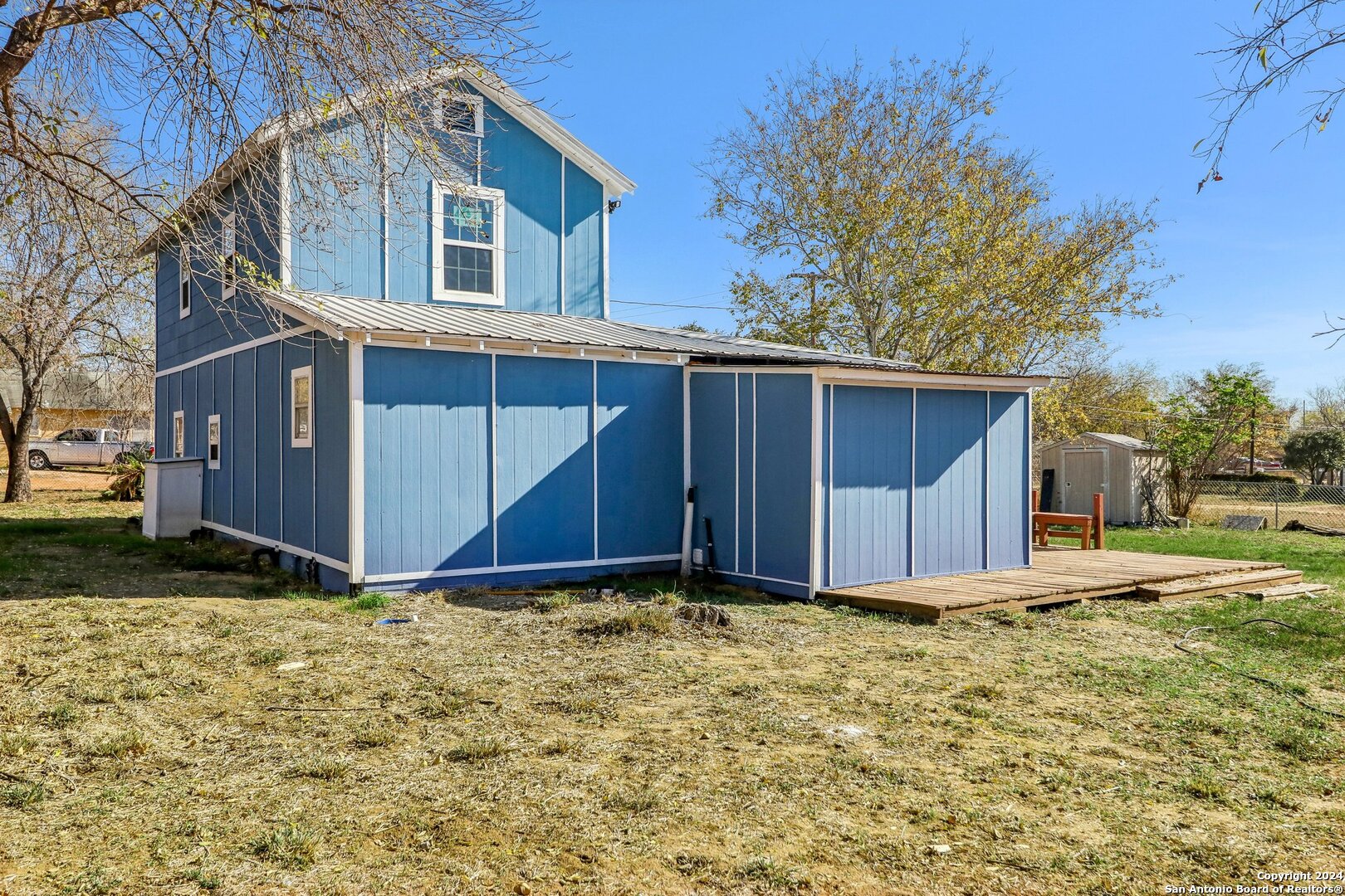 132 Renfro Drive Devine, TX 78016 - Photo 29 of 36 a view of backyard with large tree
