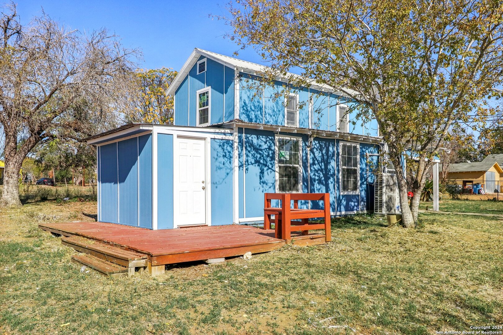 132 Renfro Drive Devine, TX 78016 - Photo 31 of 36 a front view of a house with a yard table and chairs