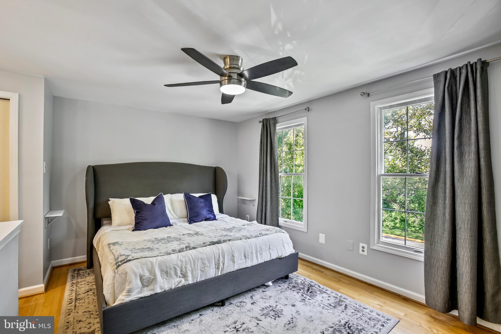 1675 Poplar Grove Drive Reston, VA 20194 - Photo 11 of 32 a bedroom with a large bed and a large window