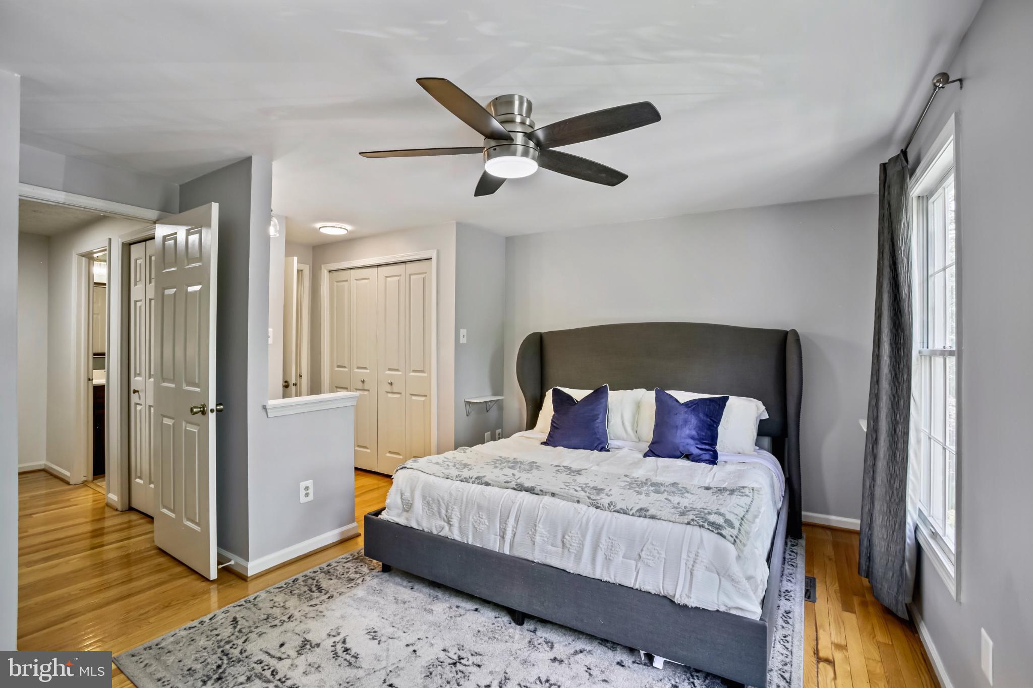 1675 Poplar Grove Drive Reston, VA 20194 - Photo 12 of 32 a bedroom with a bed and a ceiling fan