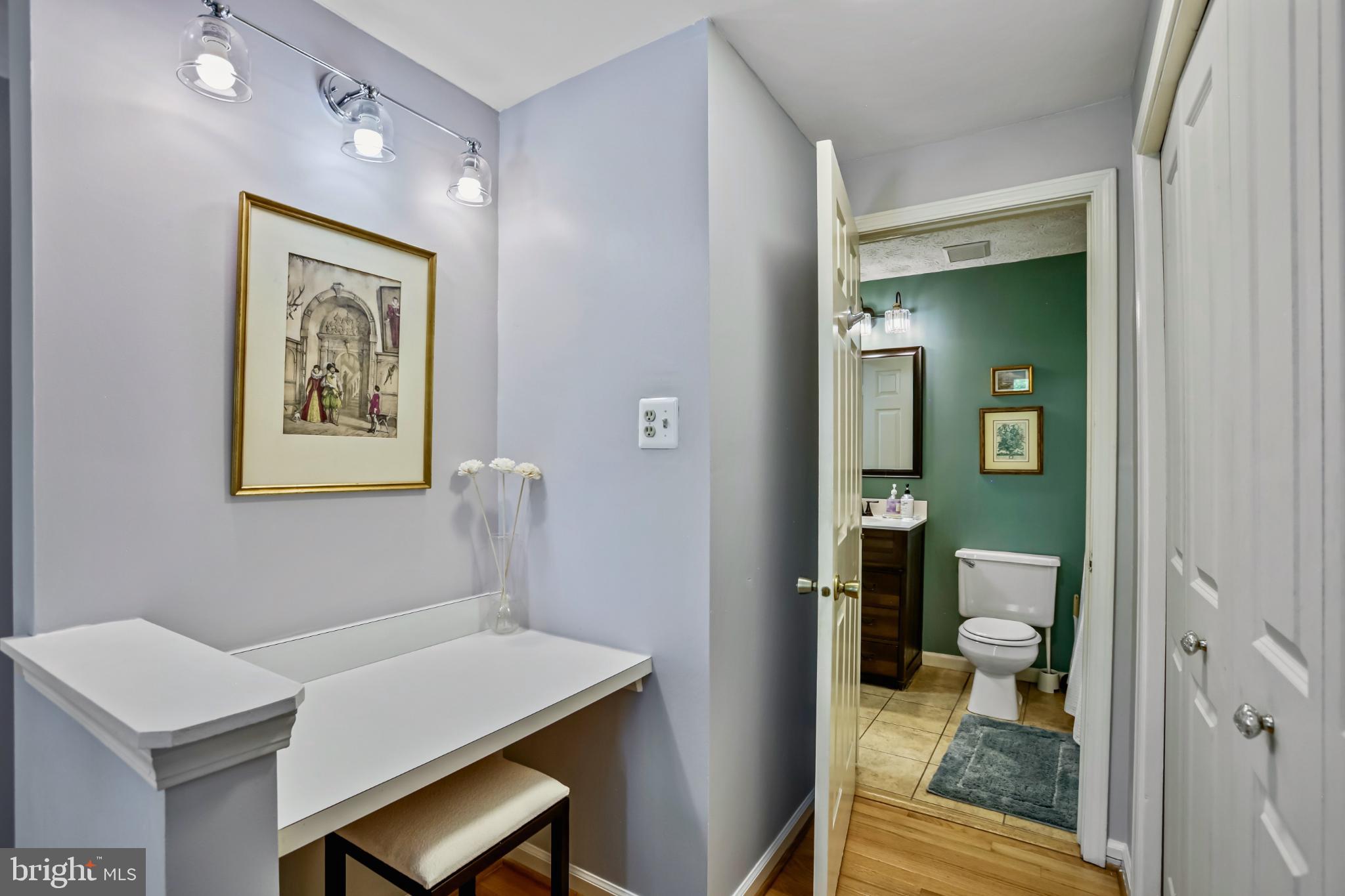1675 Poplar Grove Drive Reston, VA 20194 - Photo 13 of 32 a view of a hallway with furniture and wooden floor