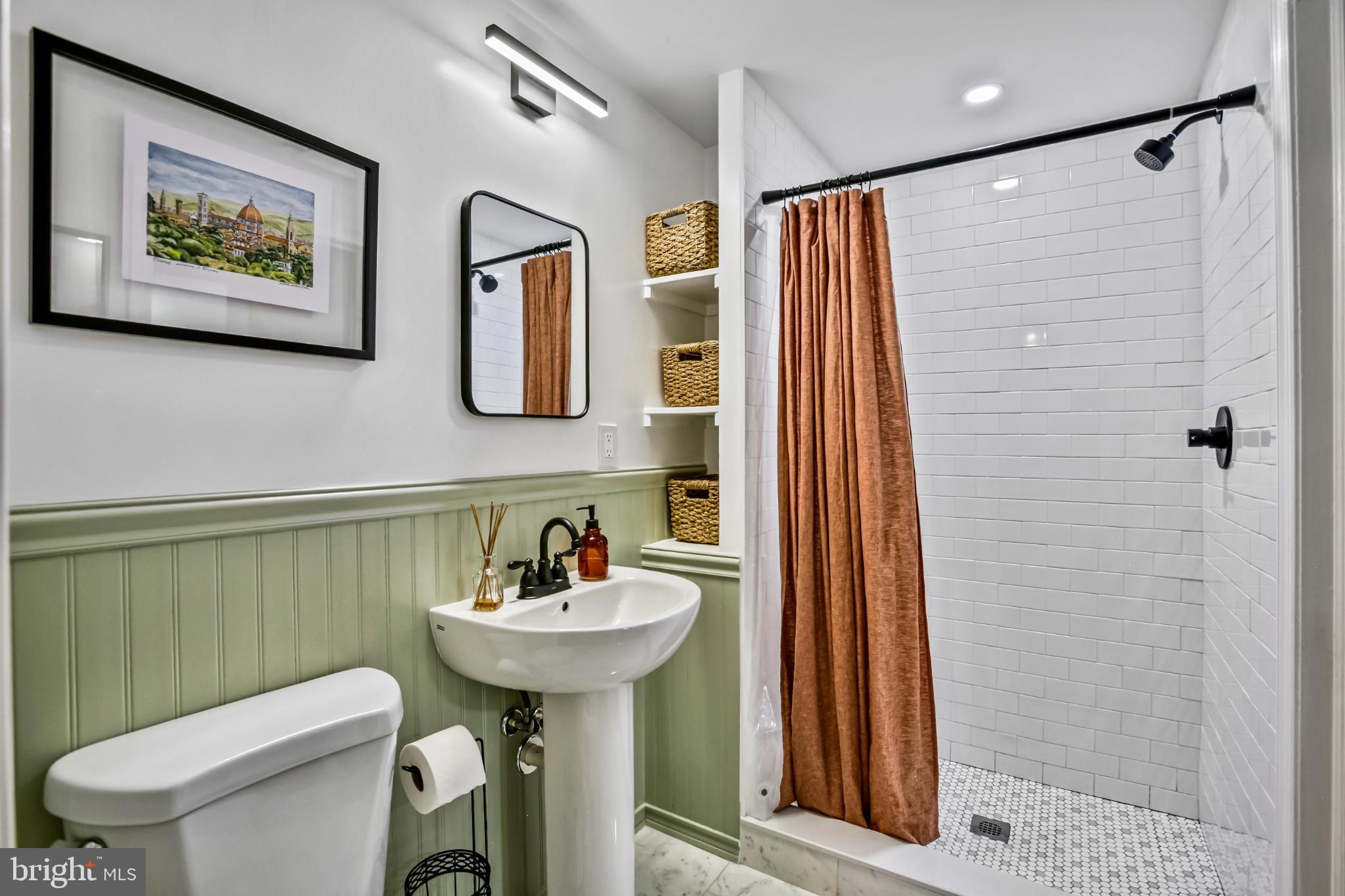 1675 Poplar Grove Drive Reston, VA 20194 - Photo 20 of 32 a bathroom with a sink toilet and shower
