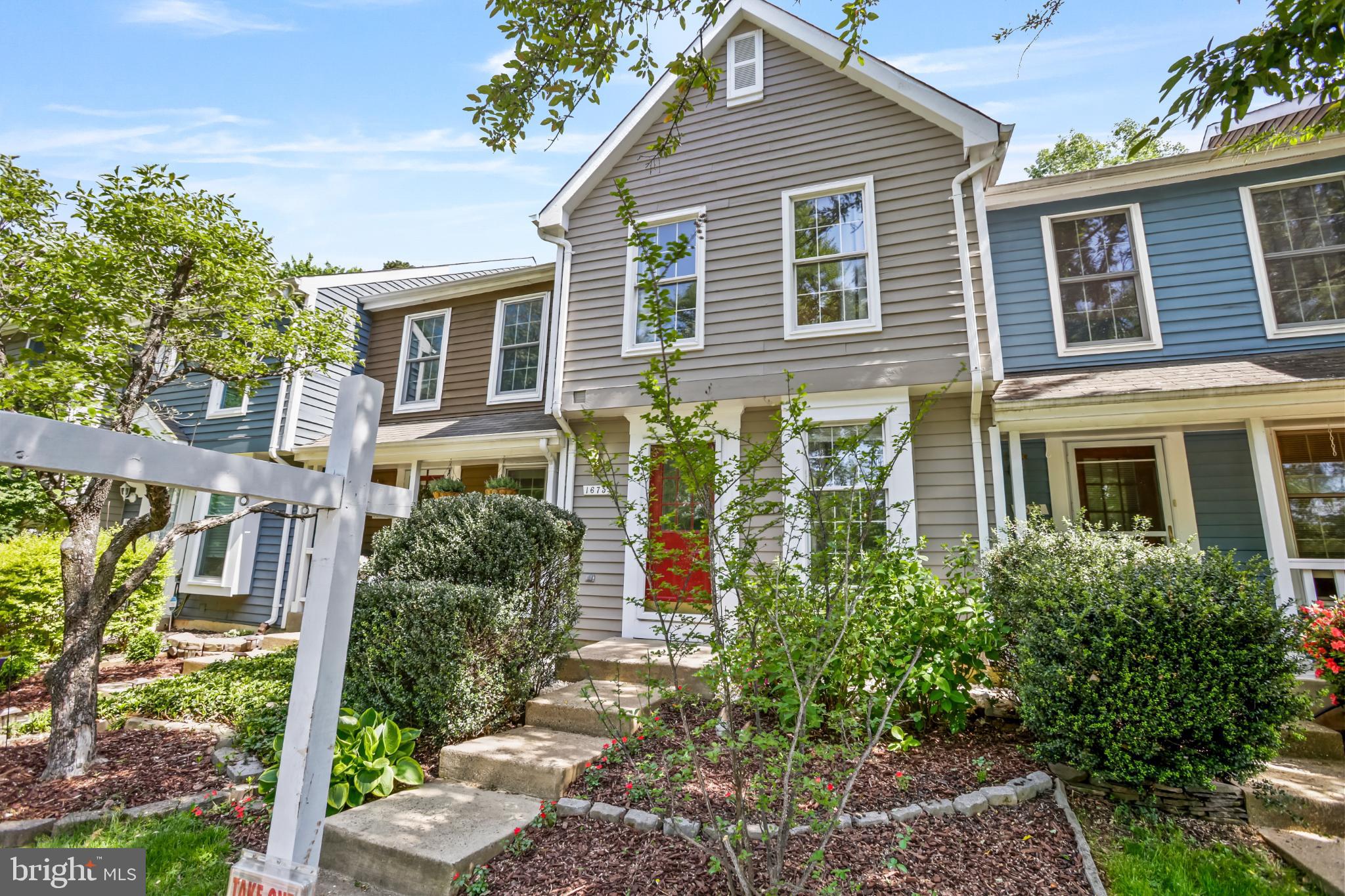 1675 Poplar Grove Drive Reston, VA 20194 - Photo 29 of 32 a front view of a house with a yard