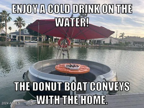 a view of a chairs and table on the lake