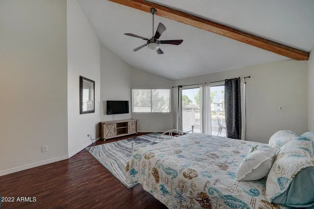 a bathroom with a toilet and a window