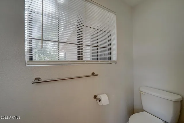 a outdoor space with patio the couches and a potted plant on the wall