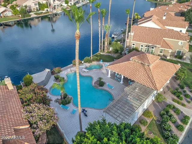 an aerial view of a house with a lake view