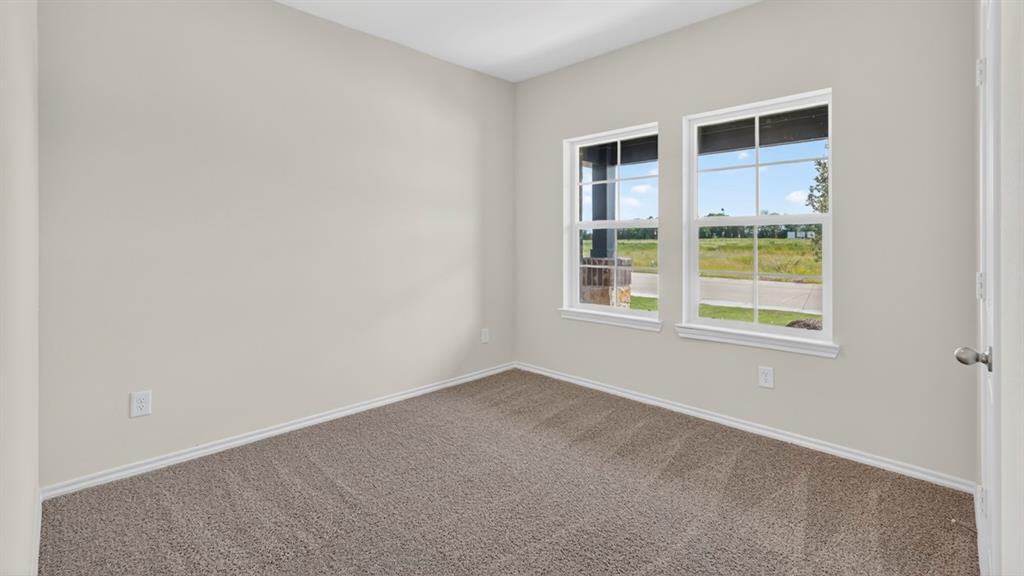 1683 Mantle Road Crandall, TX 75114 - Photo 23 of 31 Neutral tone walls and carpeting create a versatile interior space