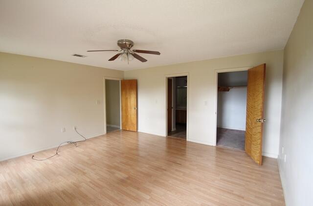 465 Ridge Lake Road Crestview, FL 32536 - Photo 23 of 34 a view of empty room with wooden floor and ceiling fan