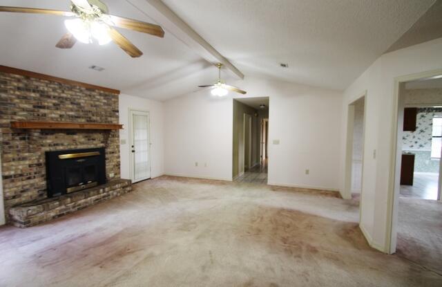 465 Ridge Lake Road Crestview, FL 32536 - Photo 3 of 34 an empty room with windows and fireplace