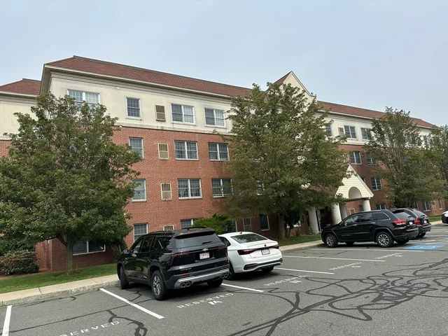 a car parked in front of a white house