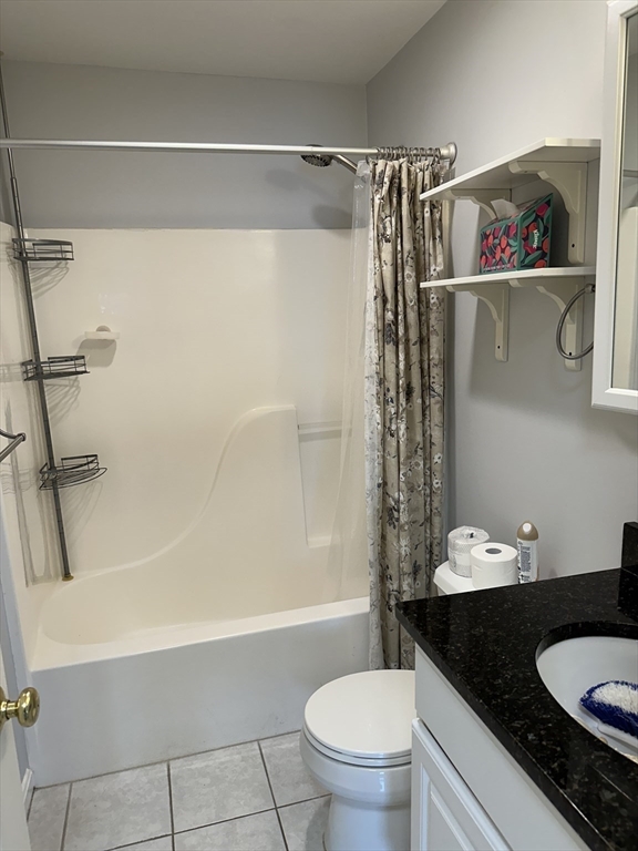 20 Heaths Court, Unit 309 Lynn, MA 01905 - Photo 14 of 18 a bathroom with a granite countertop sink toilet and shower