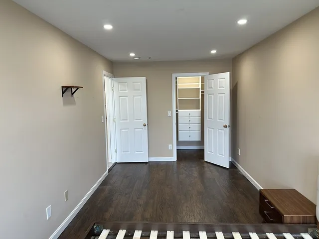 an empty room with closet area