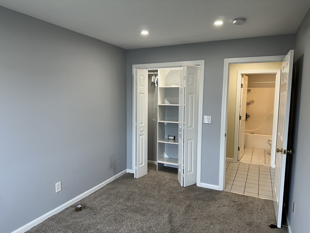 20 Heaths Court, Unit 309 Lynn, MA 01905 - Photo 17 of 18 an empty room with closet area