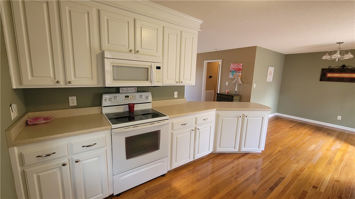 325 McAdams School Road Honea Path, SC 29654 - Photo 8 of 22 A well-equipped kitchen features ample cabinetry and a practical peninsula for meal prep.