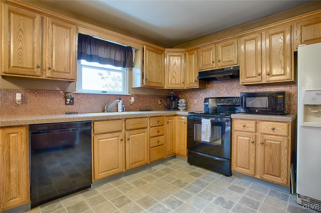 761 Lahr Road Nazareth, PA 18064 - Photo 7 of 30 a kitchen with stainless steel appliances granite countertop a stove sink and cabinets