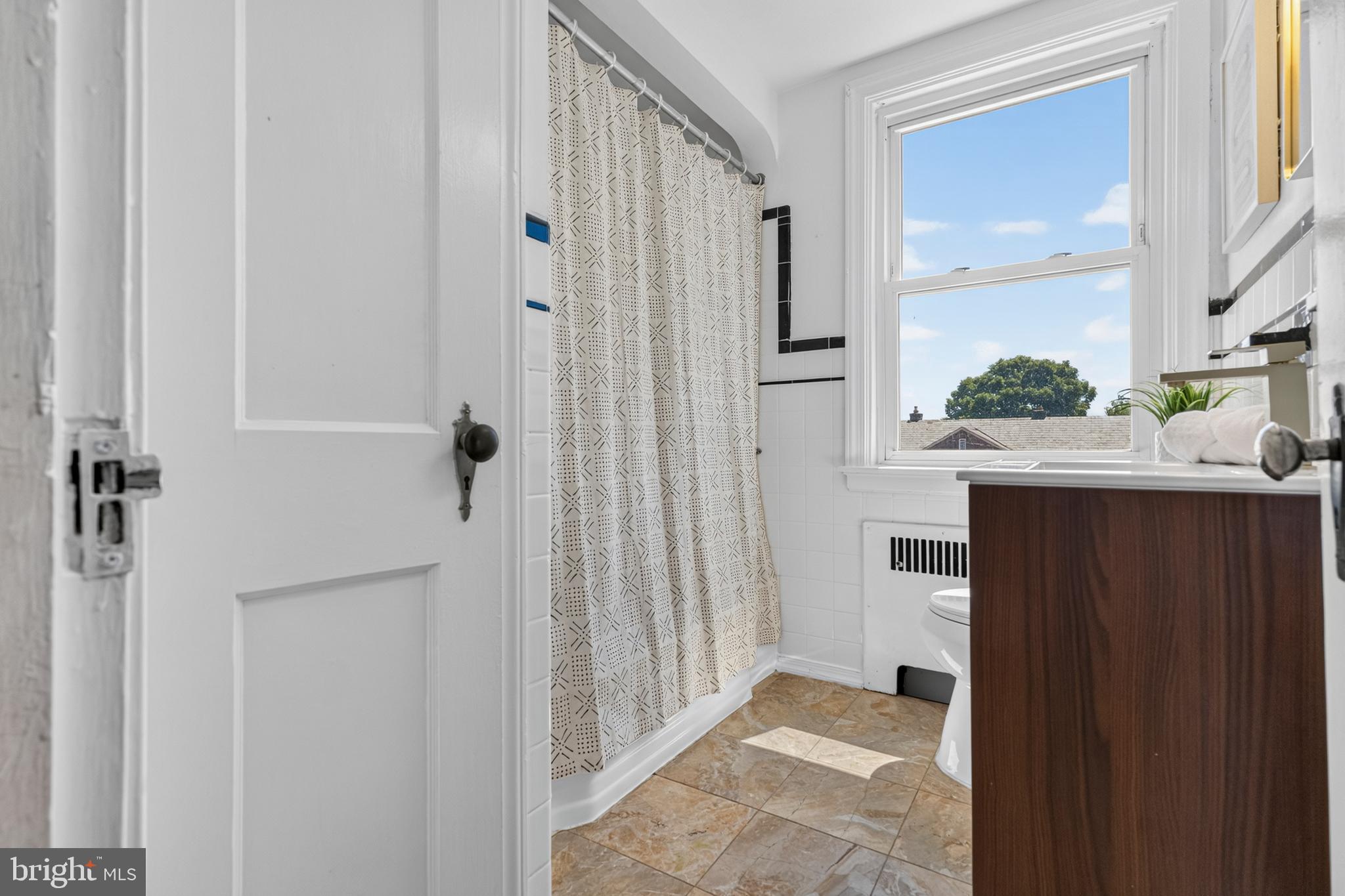 3906 Yolando Road Baltimore, MD 21218 - Photo 20 of 30 a view of a bathroom from a hallway