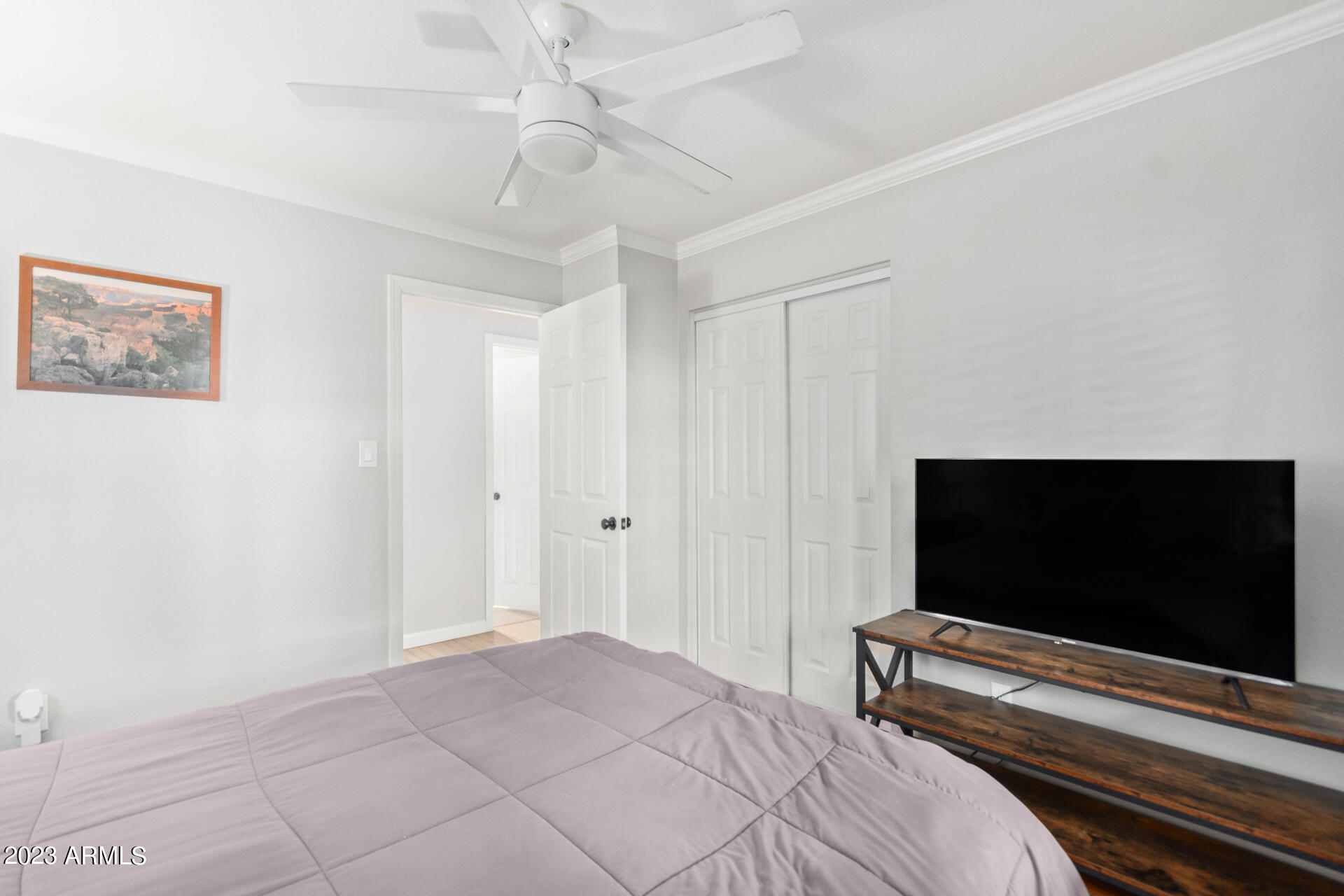 4401 North 12th Street, Unit 120 Phoenix, AZ 85014 - Photo 11 of 21 a bedroom with a bed and a flat screen tv