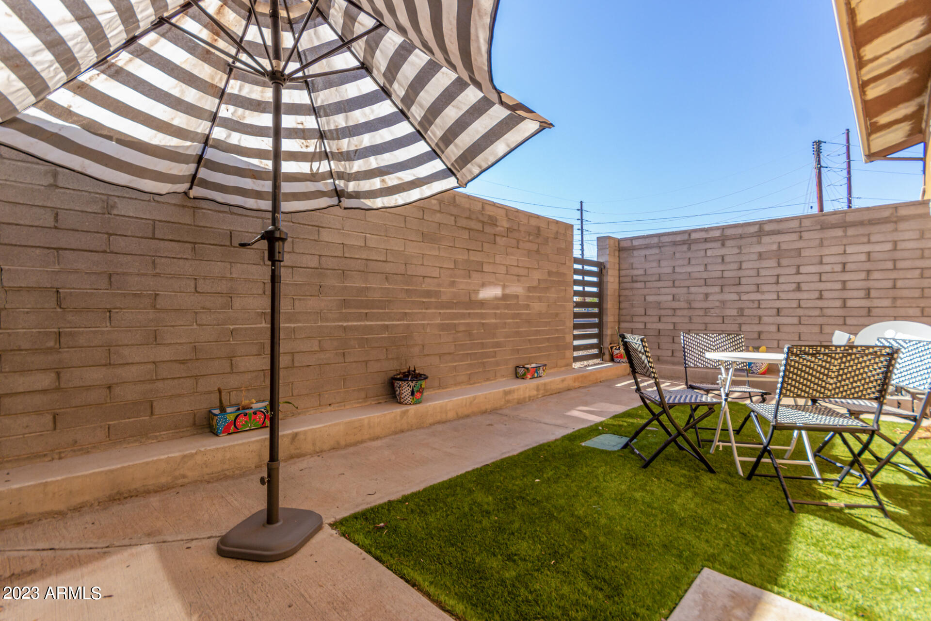 4401 North 12th Street, Unit 120 Phoenix, AZ 85014 - Photo 13 of 21 a patio with table and chairs