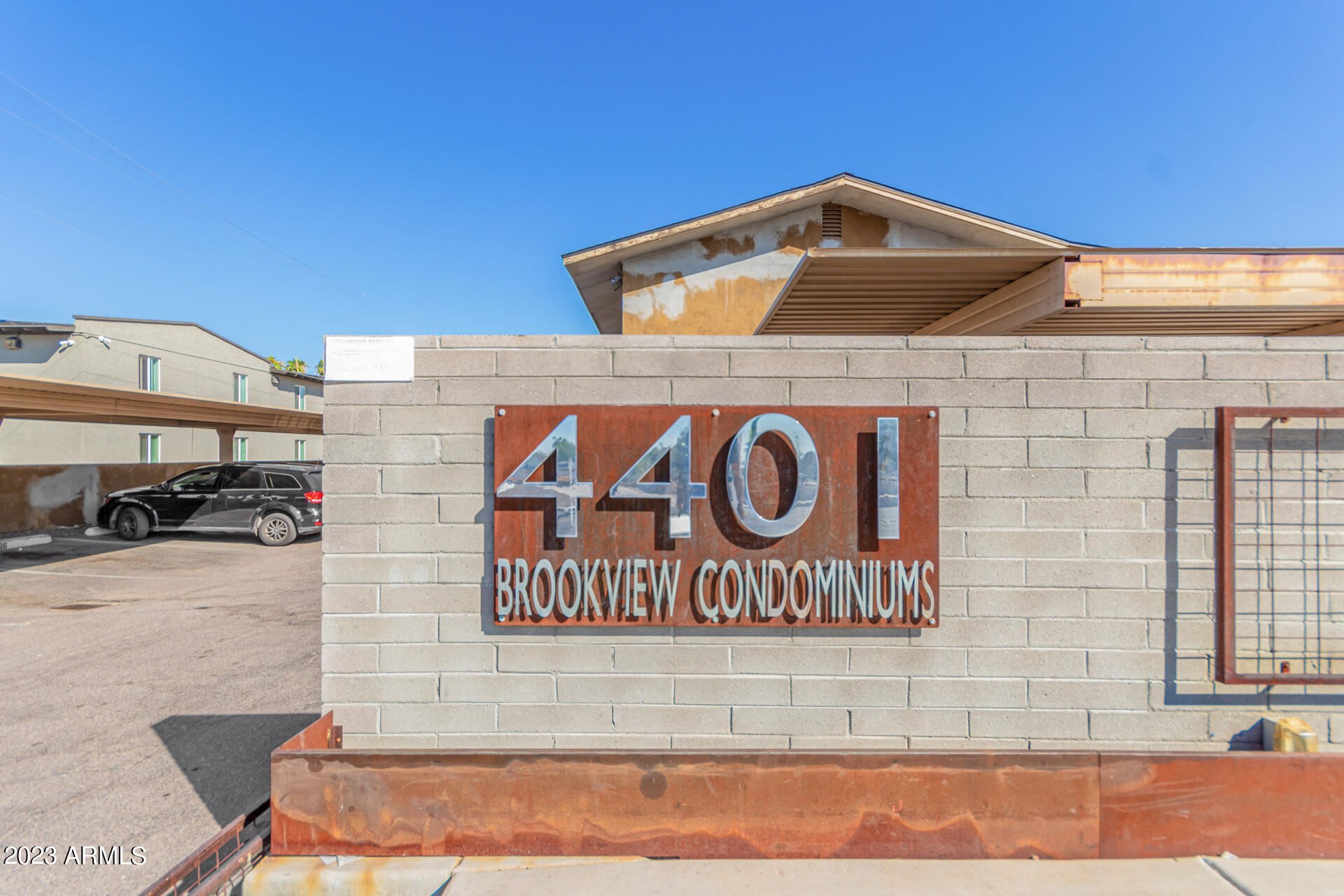 4401 North 12th Street, Unit 120 Phoenix, AZ 85014 - Photo 21 of 21 a front view of a building with parking area