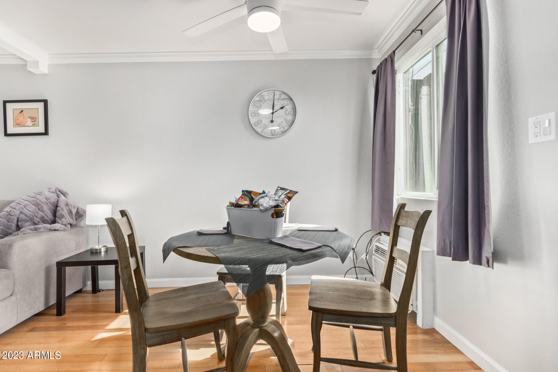 4401 North 12th Street, Unit 120 Phoenix, AZ 85014 - Photo 5 of 21 a view of a dining room with furniture and a large window