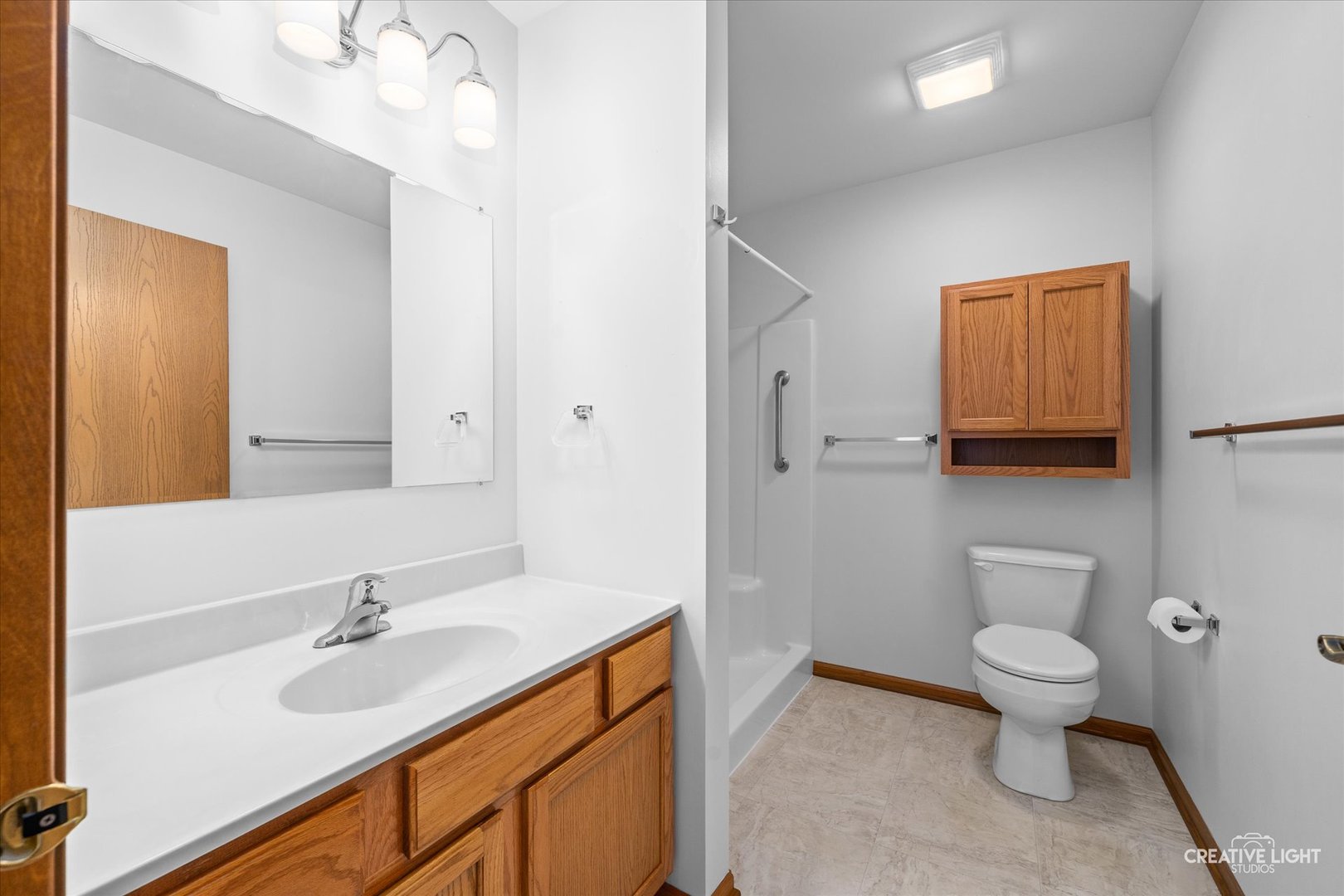 48 Silver Trail North Aurora, IL 60542 - Photo 13 of 29 a bathroom with a toilet sink and mirror