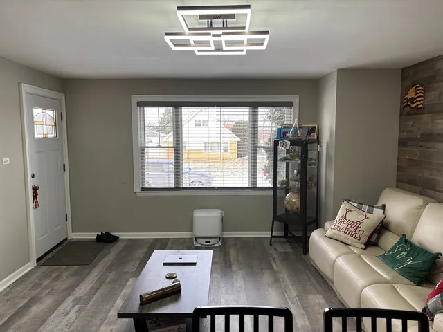 a kitchen with stainless steel appliances kitchen island granite countertop a sink and a stove