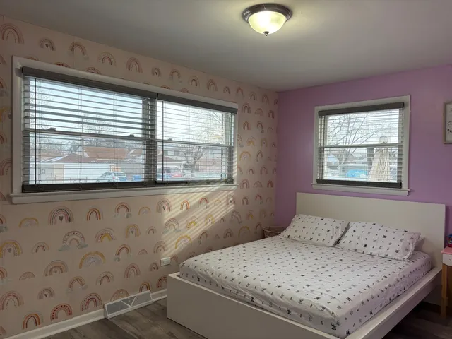 a bathroom with a sink mirror and window