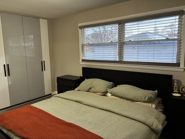 a bedroom with a bed and a walk in closet