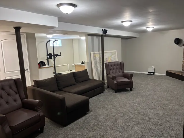 a living room with furniture and a table