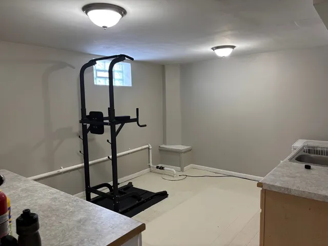 a view of a room with furniture and a chandelier