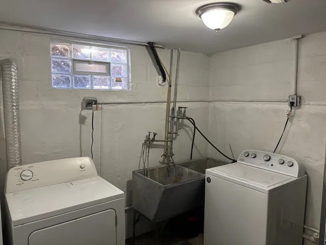 a bathroom with a black white checkered floor
