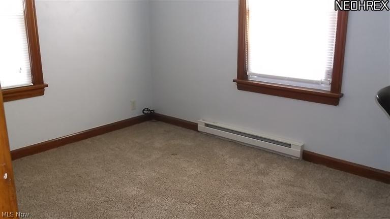 4335 7th Street Northwest Canton, OH 44708 - Photo 17 of 21 The second Bedroom on Main level shows new carpet