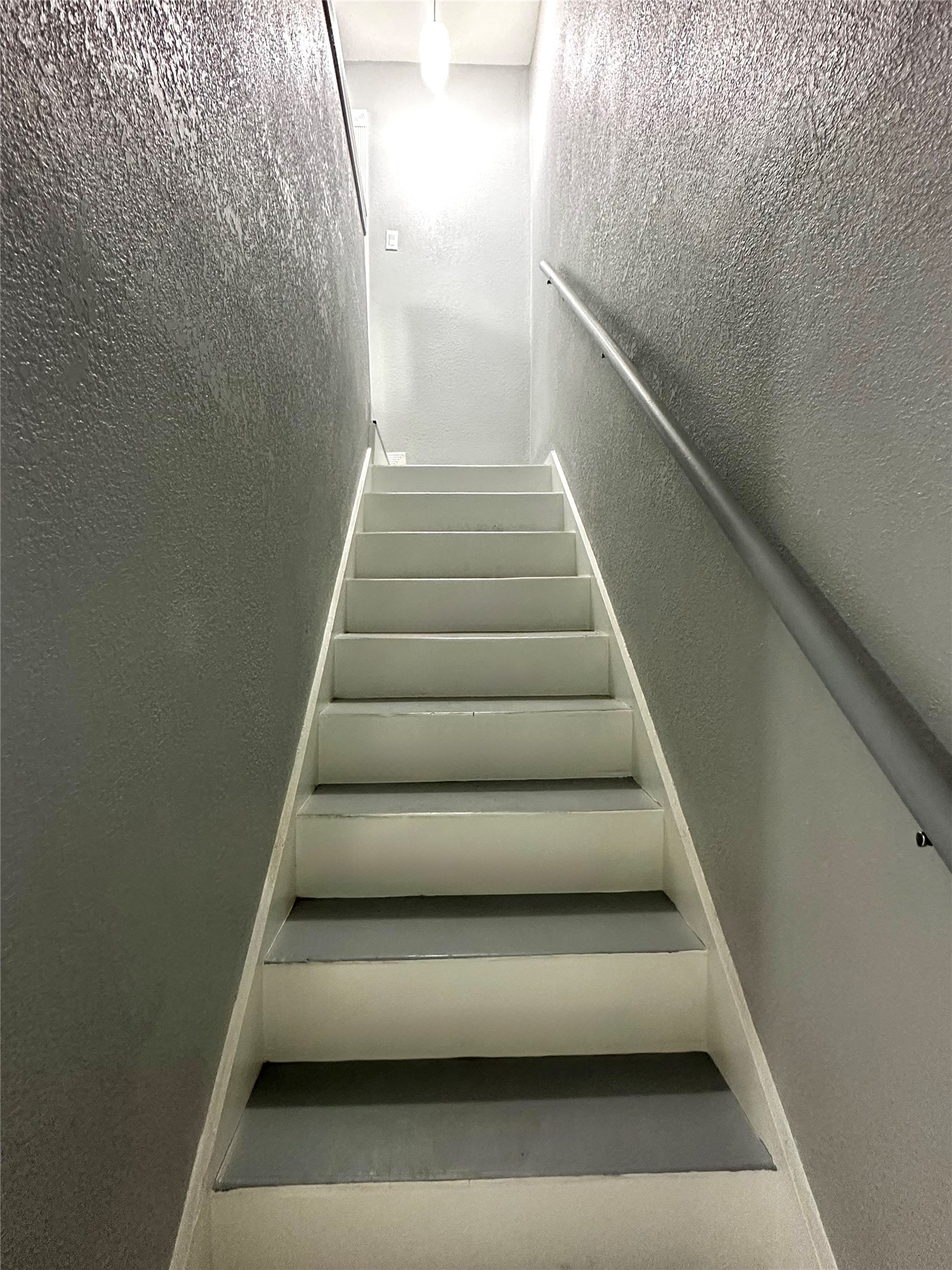 9505 Neuens Road, Unit 10 Houston, TX 77080 - Photo 7 of 7 a view of staircase with white walls