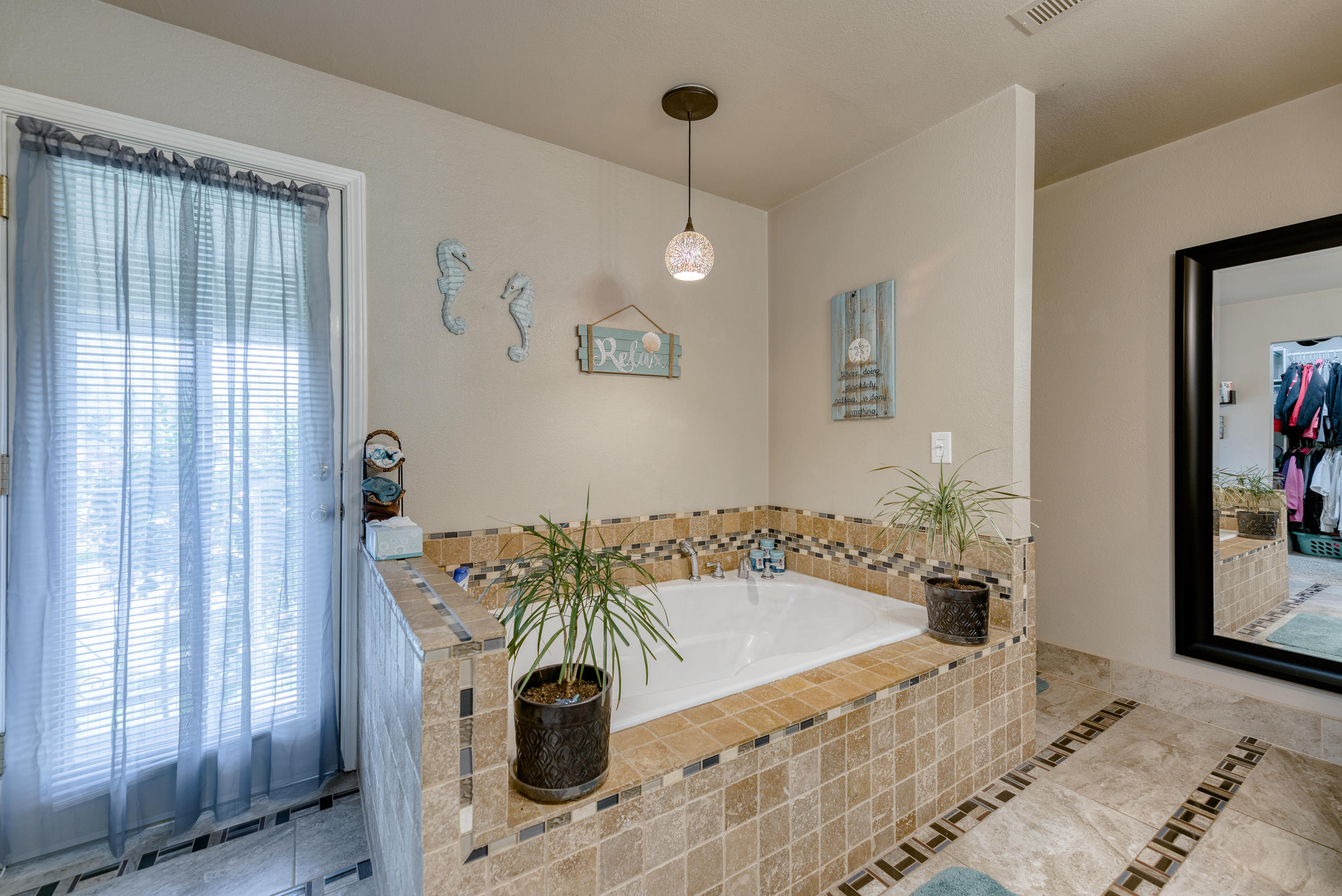 2016 Canyon Road Redding, CA 96001 - Photo 17 of 35 a bath tub sitting in a bathroom next to a window