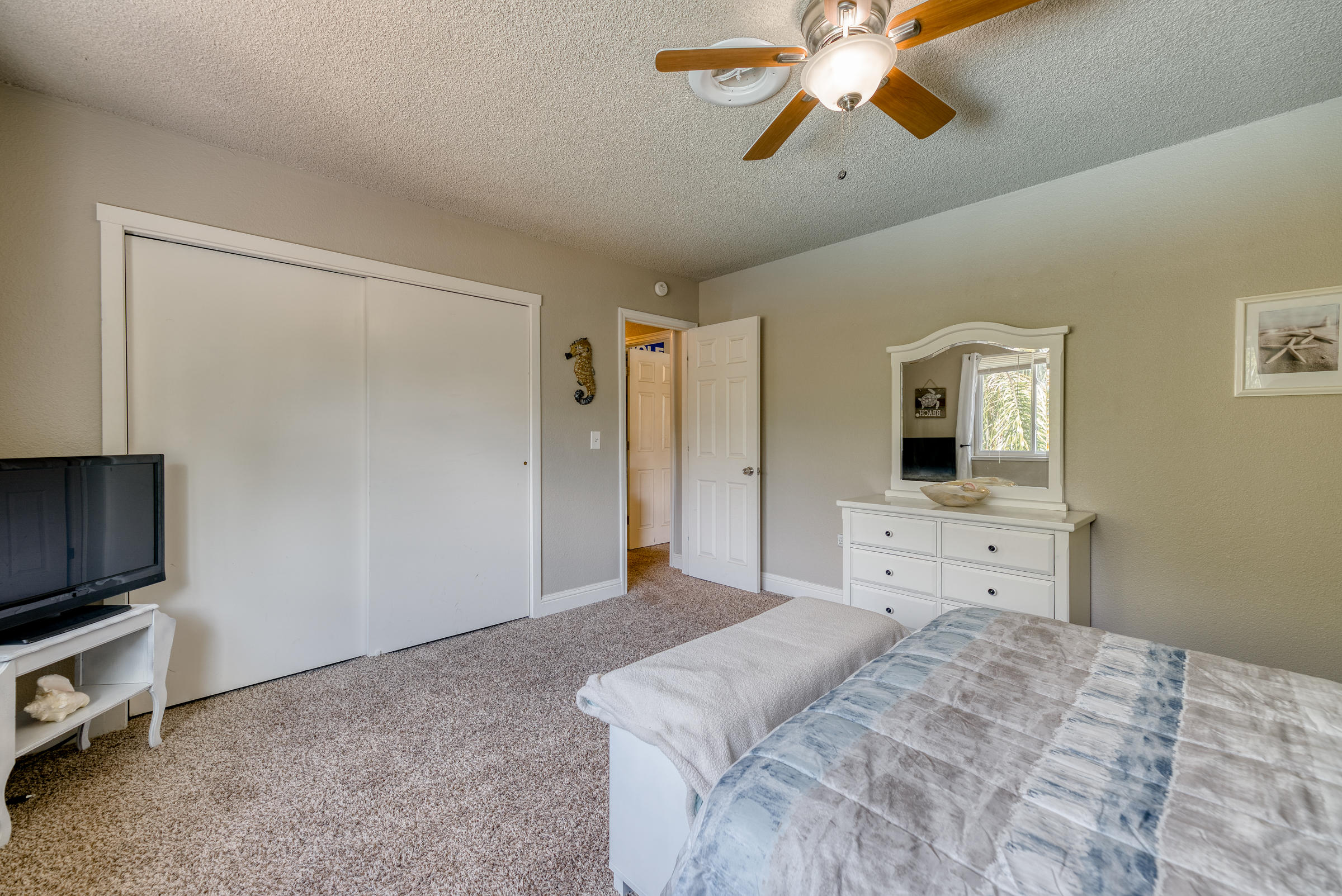 2016 Canyon Road Redding, CA 96001 - Photo 20 of 35 a bedroom with a bed and a chandelier