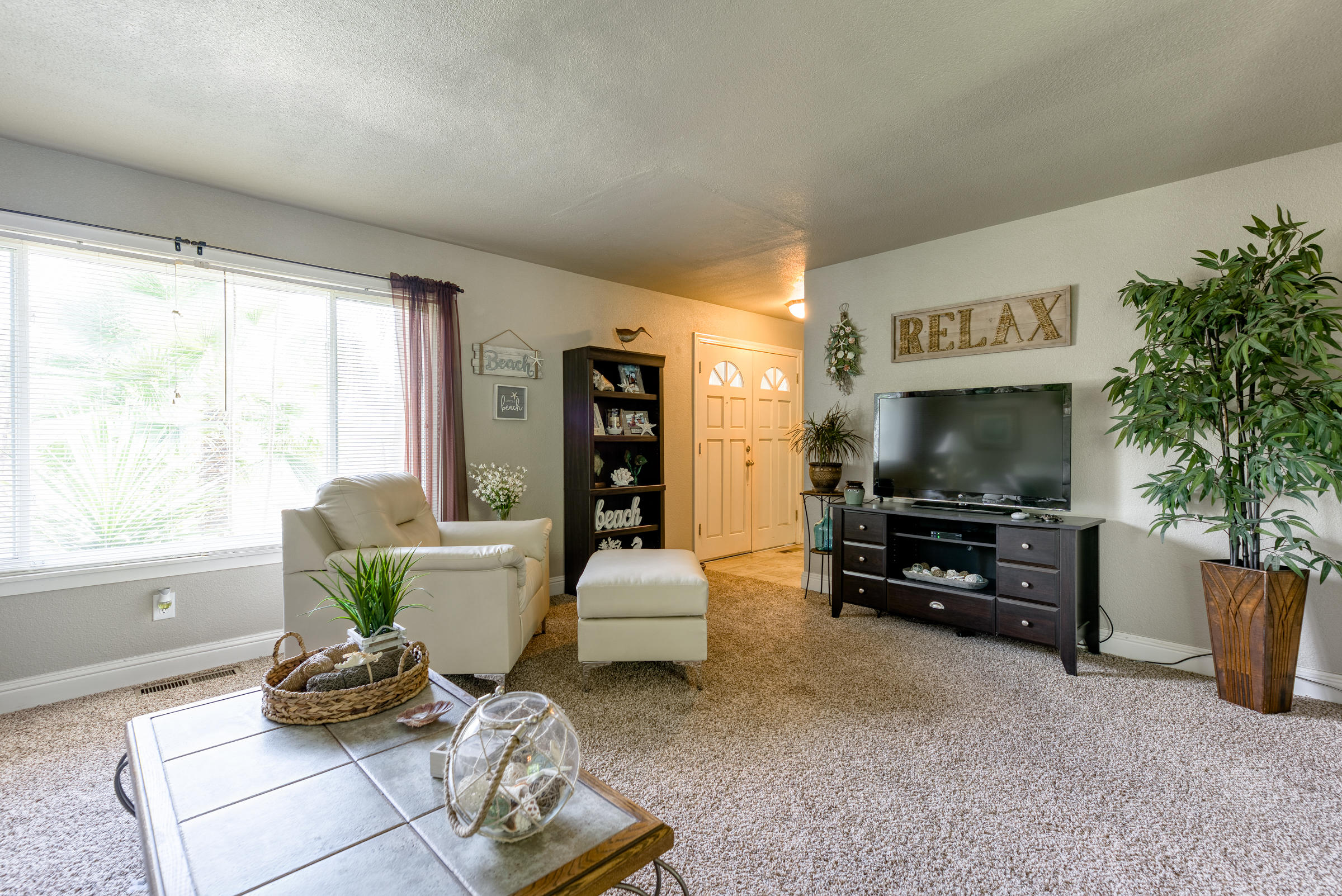2016 Canyon Road Redding, CA 96001 - Photo 8 of 35 a living room with furniture and a flat screen tv