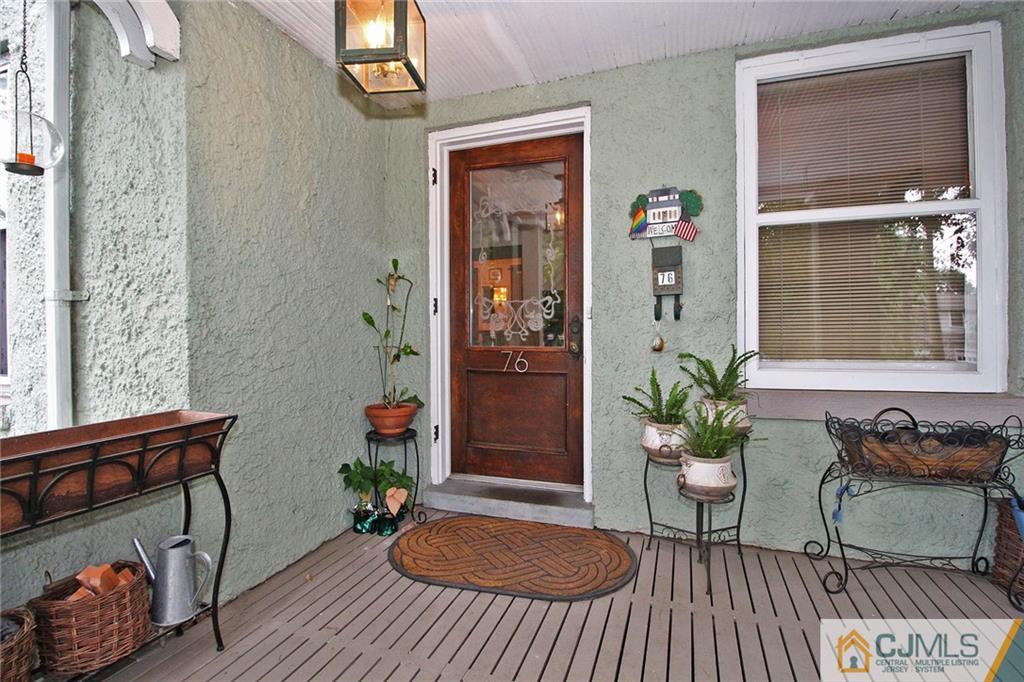 76 Rector Street Metuchen, NJ 08840 - Photo 2 of 25 a living room with furniture and a potted plant