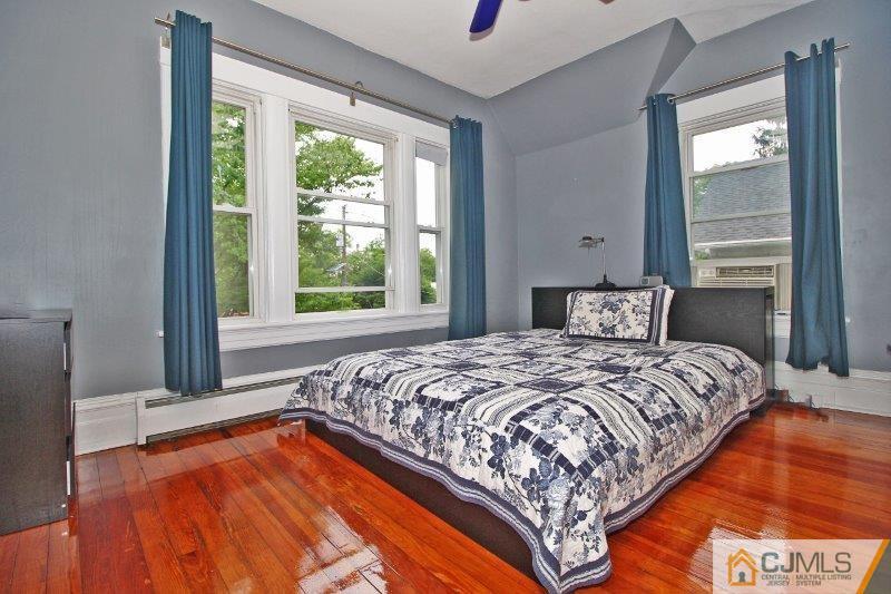 76 Rector Street Metuchen, NJ 08840 - Photo 11 of 25 a bedroom with a bed and a window