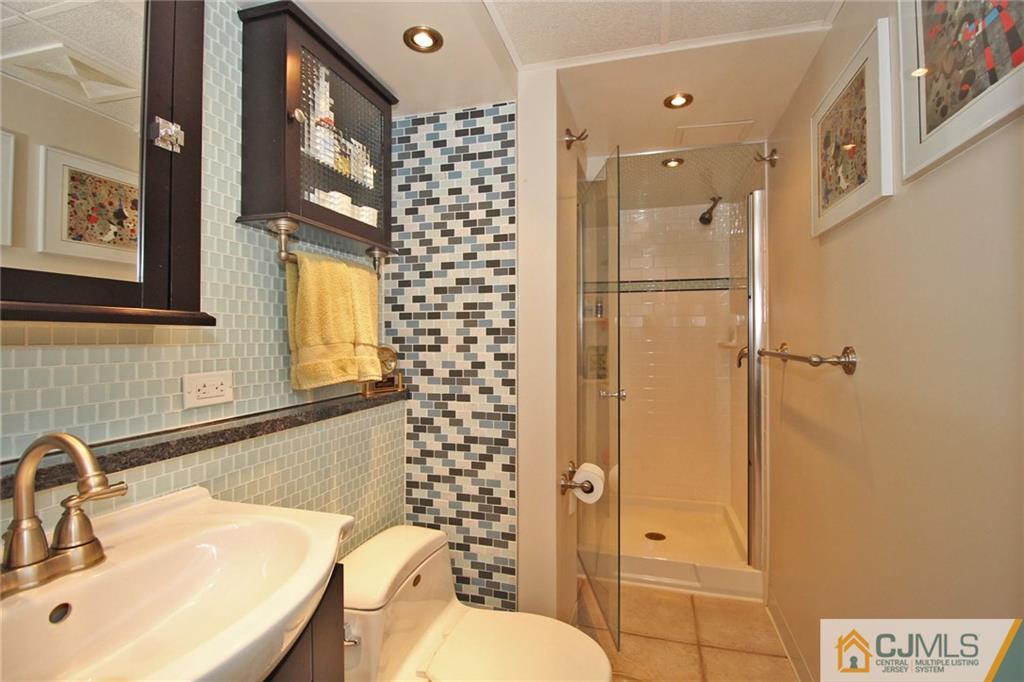 76 Rector Street Metuchen, NJ 08840 - Photo 20 of 25 a bathroom with a sink toilet and shower