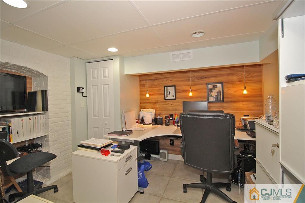 76 Rector Street Metuchen, NJ 08840 - Photo 21 of 25 a view of a workspace with furniture and a window