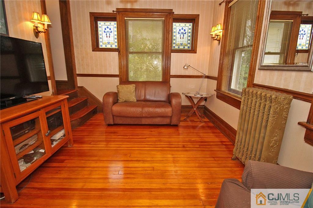 76 Rector Street Metuchen, NJ 08840 - Photo 7 of 25 a living room with furniture and a flat screen tv