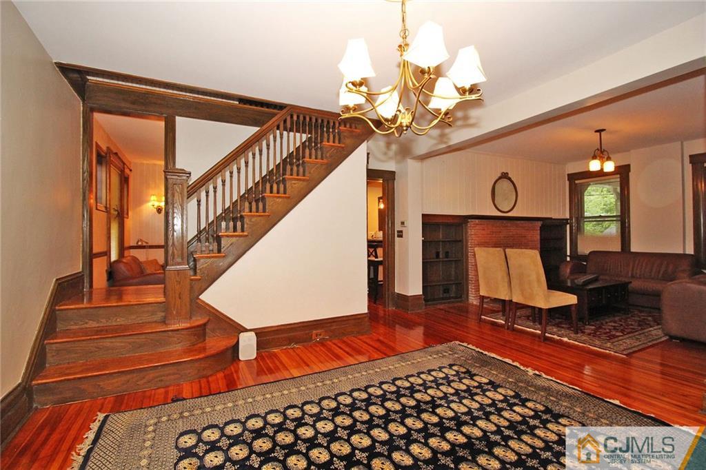 76 Rector Street Metuchen, NJ 08840 - Photo 9 of 25 a view of a livingroom with furniture and stairs