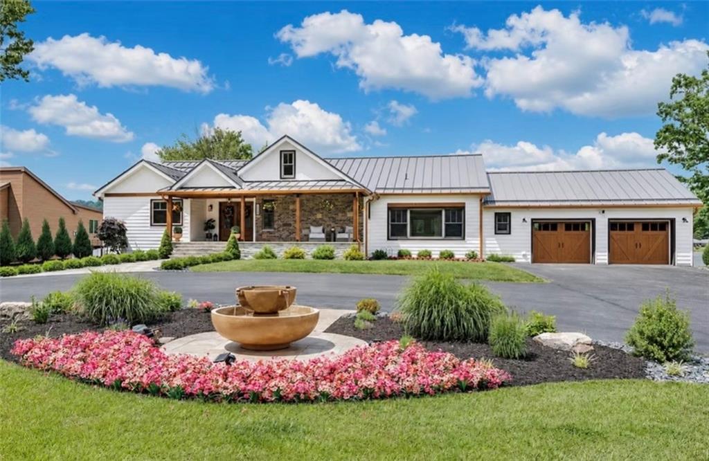 a front view of a house with garden