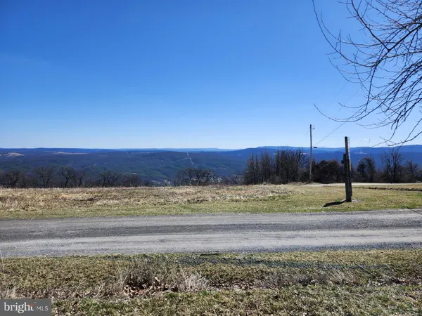 a view of mountain view with large trees