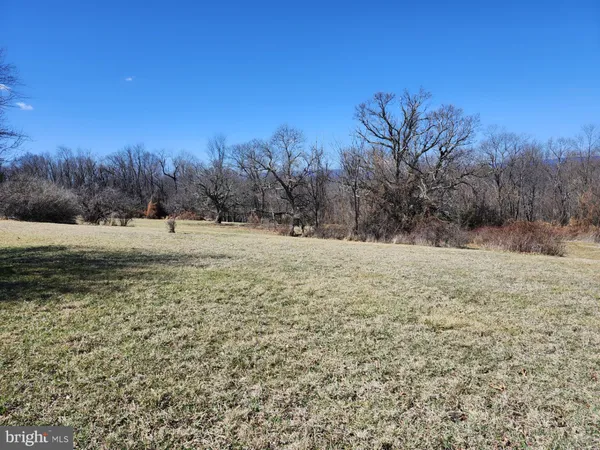 a view of an ocean beach and mountain